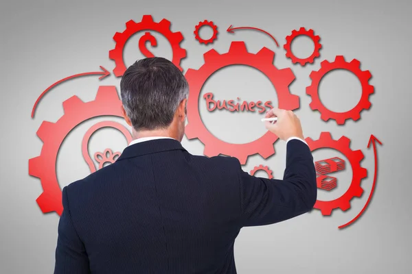 Composite image of rear view of businessman writing with chalk — Stock Photo, Image