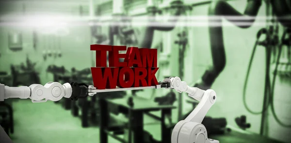 Imagem composta de mão robótica branca segurando texto de trabalho em equipe contra fundo branco — Fotografia de Stock