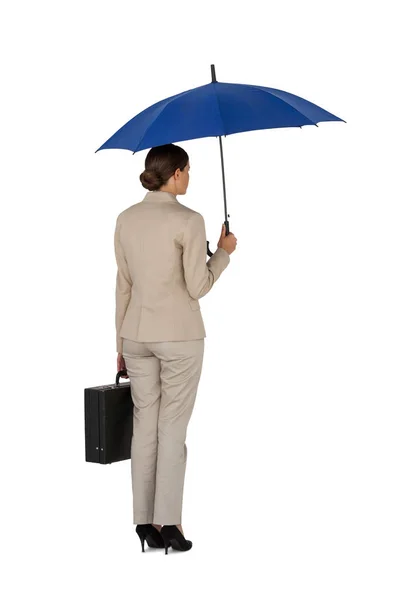 Businesswoman holding blue umbrella and a briefcase — Stock Photo, Image