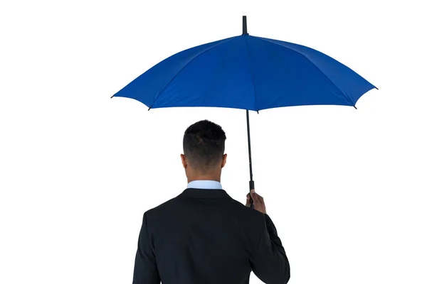 Empresário segurando guarda-chuva azul e uma pasta — Fotografia de Stock