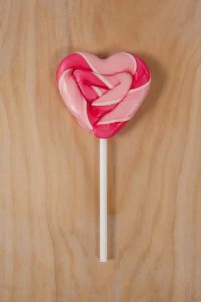 Piruleta rosa en forma de corazón — Foto de Stock