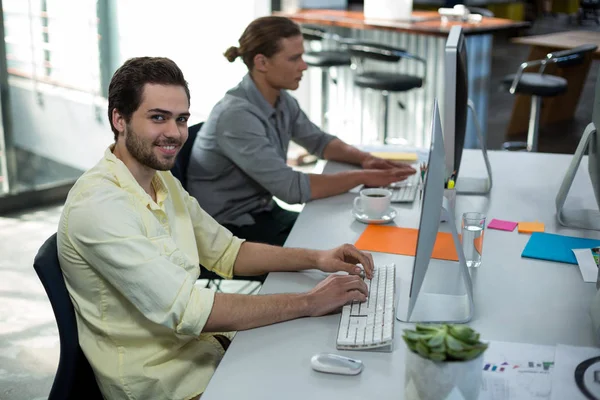Portrait of male graphic designer working on personal computer — Stock Photo, Image