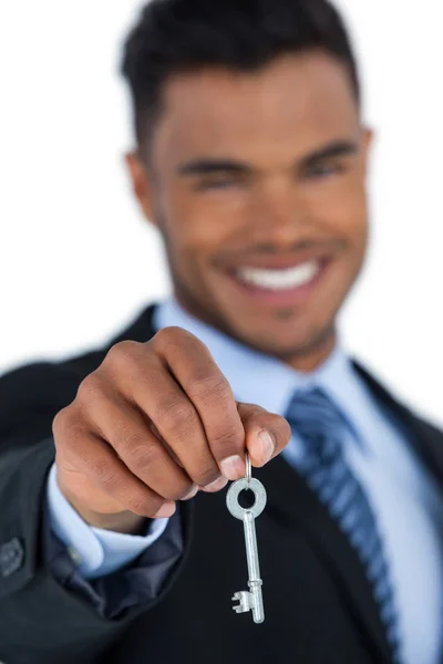 Businessman showing new house key — Stock Photo, Image