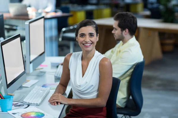 Portrait of female graphic designer working on personal computer — Stock Photo, Image
