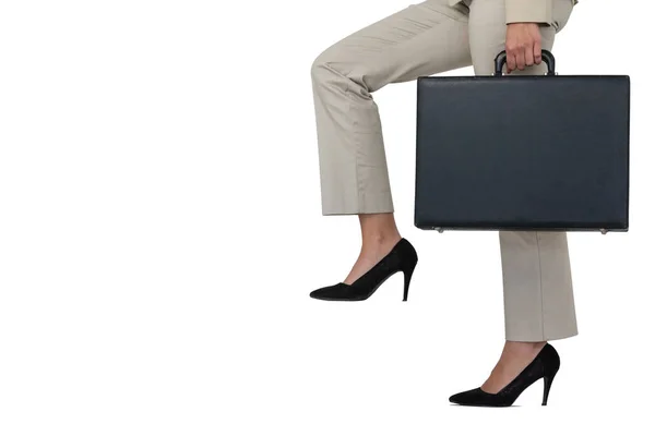 Low section of businesswoman climbing steps with briefcase — Stock Photo, Image