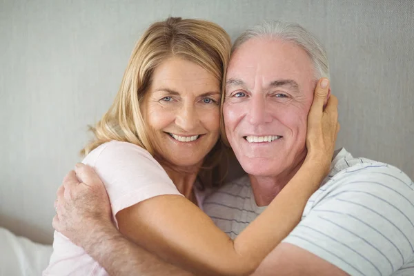 Portrait of happy senior couple embracing each other — Stock Photo, Image