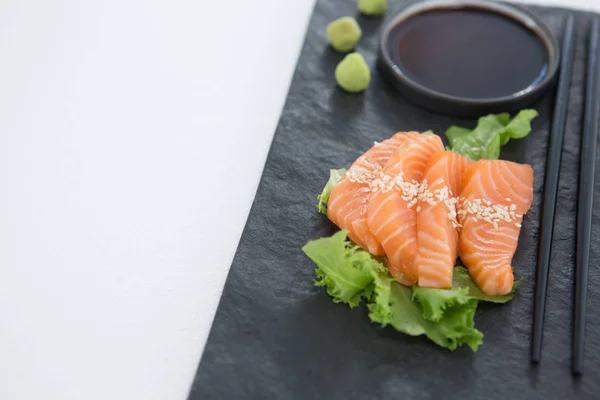 Sushi served on tray with chopsticks — Stock Photo, Image