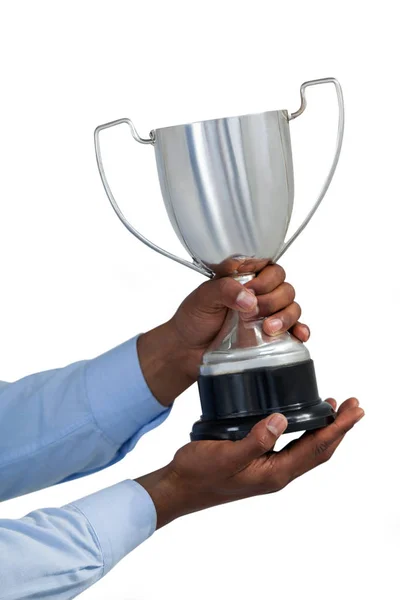 Hands of businessman holding trophy — Stock Photo, Image