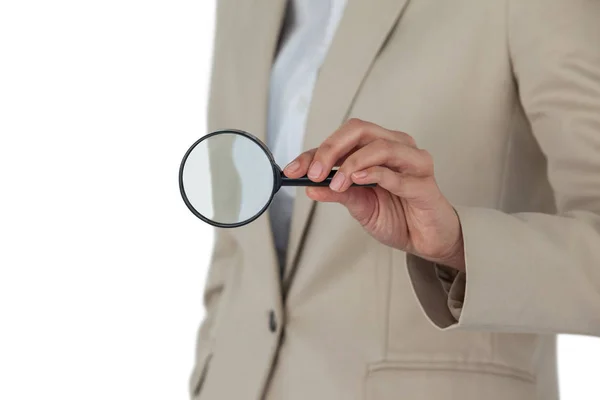 Mid section of businesswoman holding magnifying glass — Stock Photo, Image