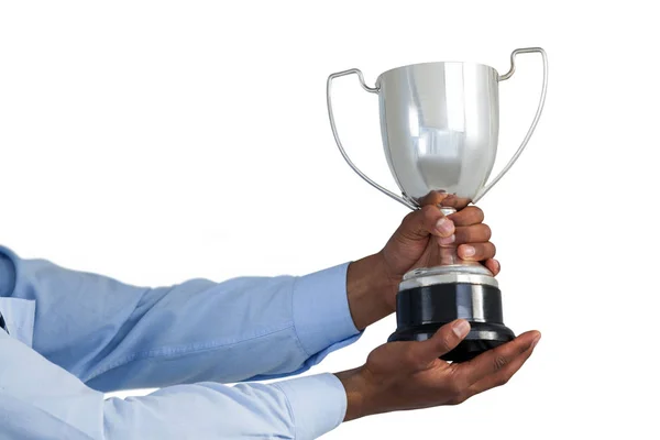 Hands of businessman holding trophy — Stock Photo, Image