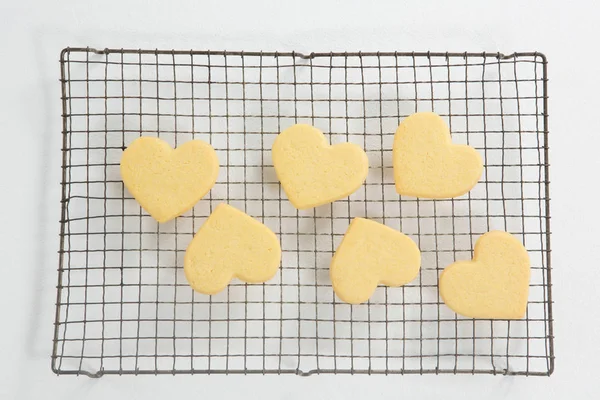 Heart shape cookies on cooling rack — Stock Photo, Image