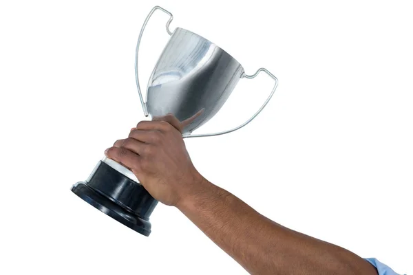Ruka držící trofej podnikatel — Stock fotografie
