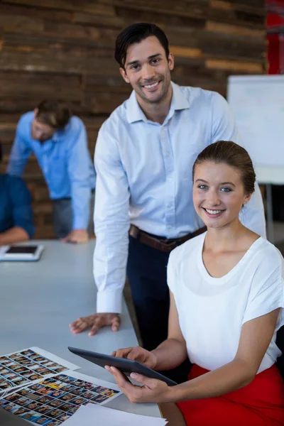 Male and female graphic designers holding digital tablet — Stock Photo, Image