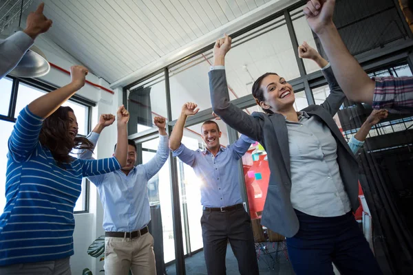 Team of businesspeople jumping in office — Stock Photo, Image