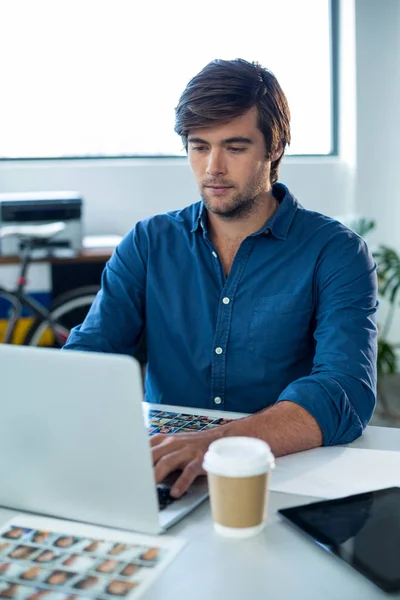 Attentive graphic designer working on laptop — Stock Photo, Image