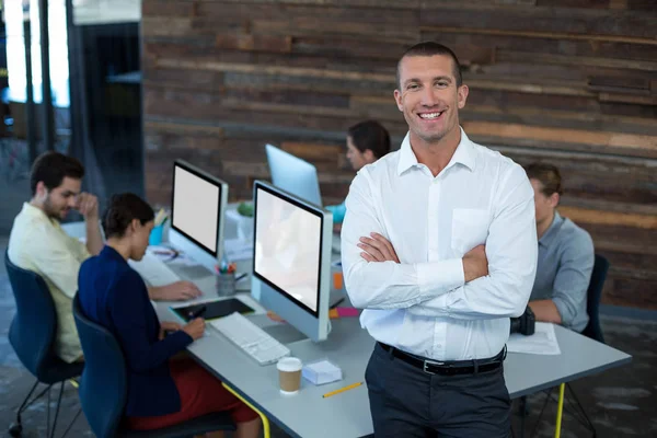 Portrait of male graphic designer standing with arms crossed — Stock Photo, Image