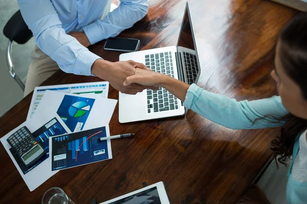 Business executives shaking hands during meeting — Stock Photo, Image