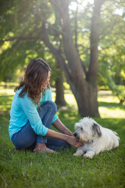 Woman with dog in park — Stock Photo, Image