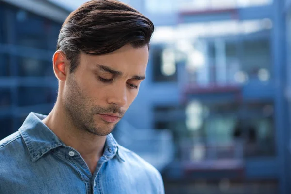 Handsome man looking down — Stock Photo, Image