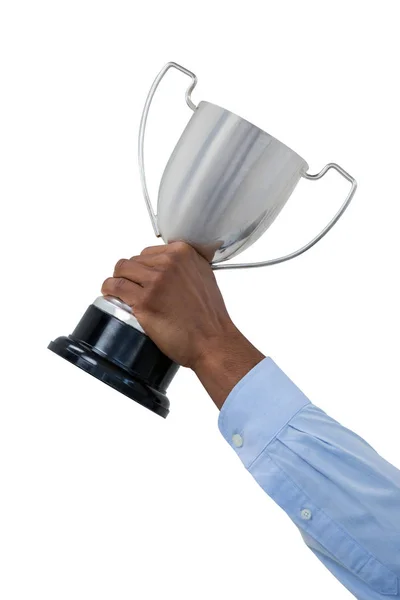 Hand van zakenman holding trofee — Stockfoto