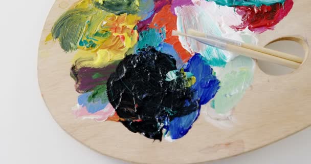 Watercolor paint on wooden palette — Stock Video