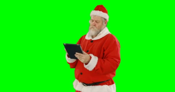 Weihnachtsmann mit digitalem Tablet — Stockvideo