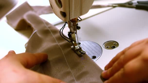 Seamstress stitching cloth on sewing machine — Stock Video