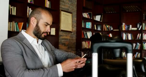 Businessman using a smartphone — Stock Video