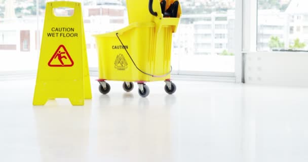 Mopping bucket with caution sign — Stock Video