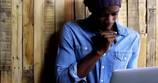 Thoughtful man using laptop — Stock Video