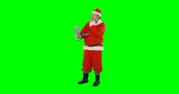 Babbo Natale utilizzando il computer portatile — Video Stock