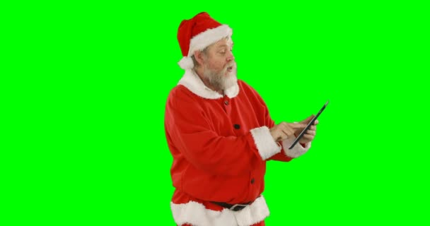Weihnachtsmann mit digitalem Tablet — Stockvideo