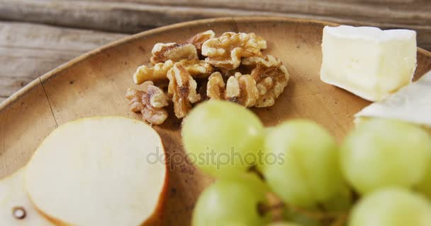 Cheese with walnuts, grapes and jam — Stock Video