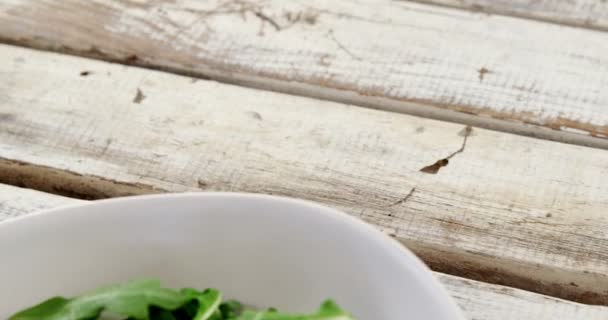 Arugula in bowl — Stock Video