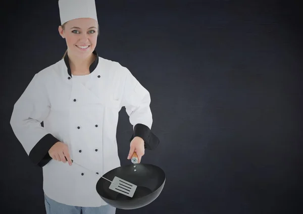 Chef with pan against black background — Stock Photo, Image