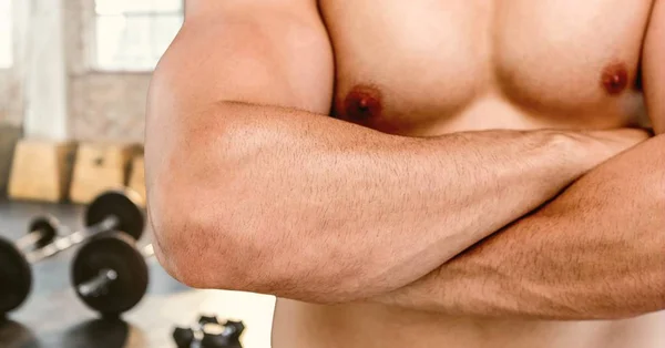 Composietbeeld van man Fitness Torso tegen gym — Stockfoto