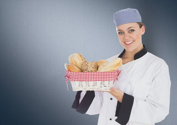 Composite image of Chef with bread against navy background — Stock Photo, Image