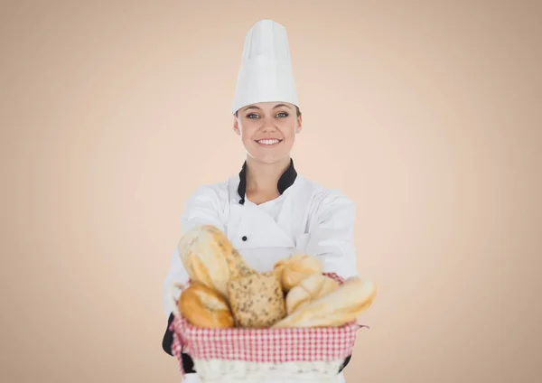 Chef with bread against cream background — Stock Photo, Image