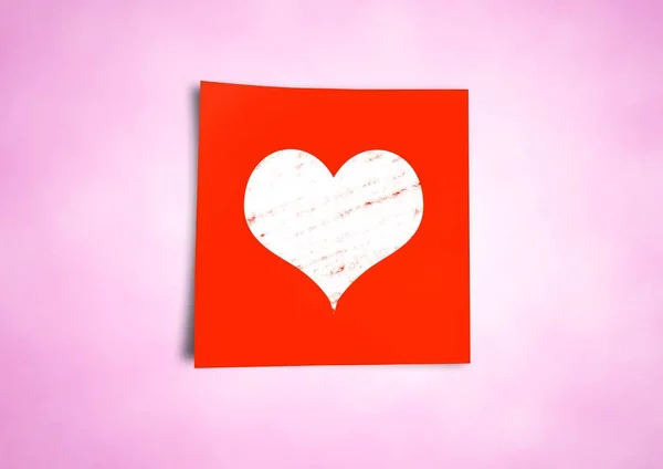 Липка нотатка з іконою серця на нейтральному рожевому фоні — стокове фото