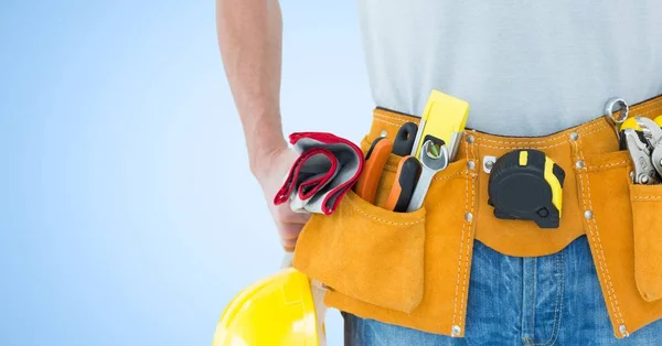 Carpenter against neutral blue background — Stock Photo, Image