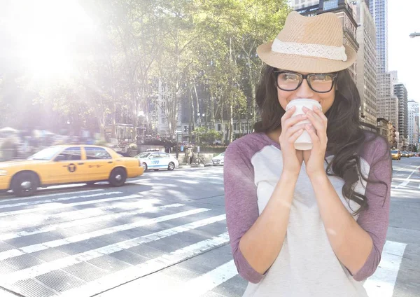 Woman drinking coffee on street with flare — Stock Photo, Image