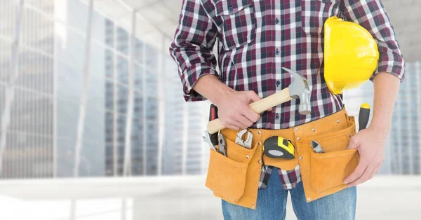Carpenter with hammer against window — Stock Photo, Image