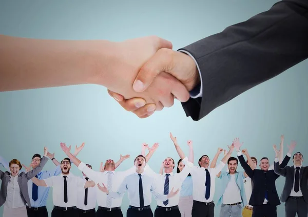 Handshake over business people with blue background — Stock Photo, Image