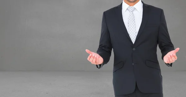 Composite image of Businessman Torso against grey background — Stock Photo, Image