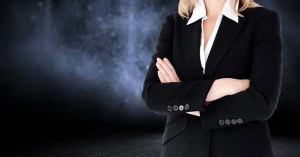 Composite image of Businesswoman Torso against dark background — Stock Photo, Image