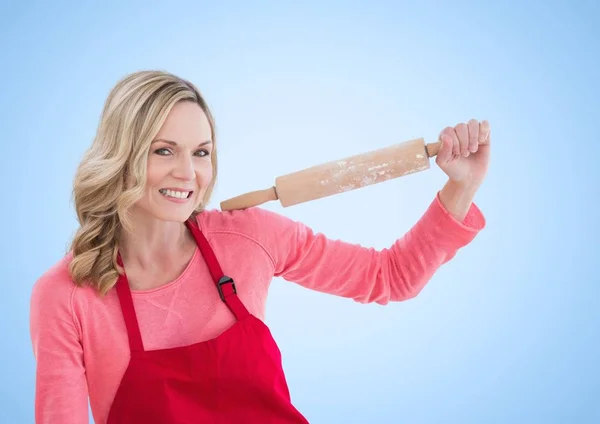 Woman with rolling pin against white background — Stock Photo, Image