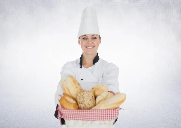 Imagen compuesta de Chef con pan sobre fondo blanco — Foto de Stock