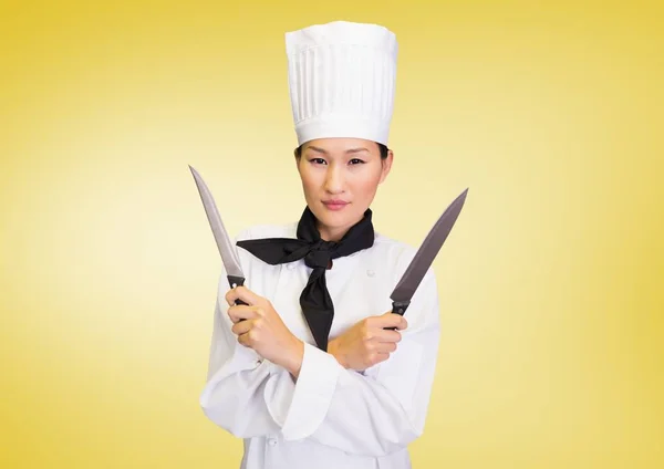 Chef with knives against yellow background
