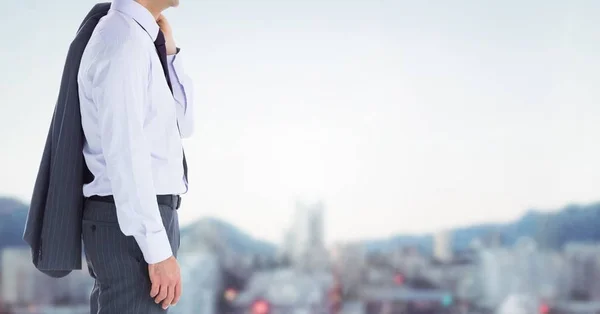 Composite image of Businessman Torso against blurry landscape — Stock Photo, Image