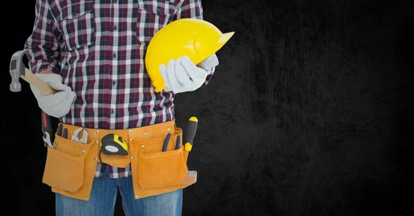 Carpenter with hammer against black background — Stock Photo, Image
